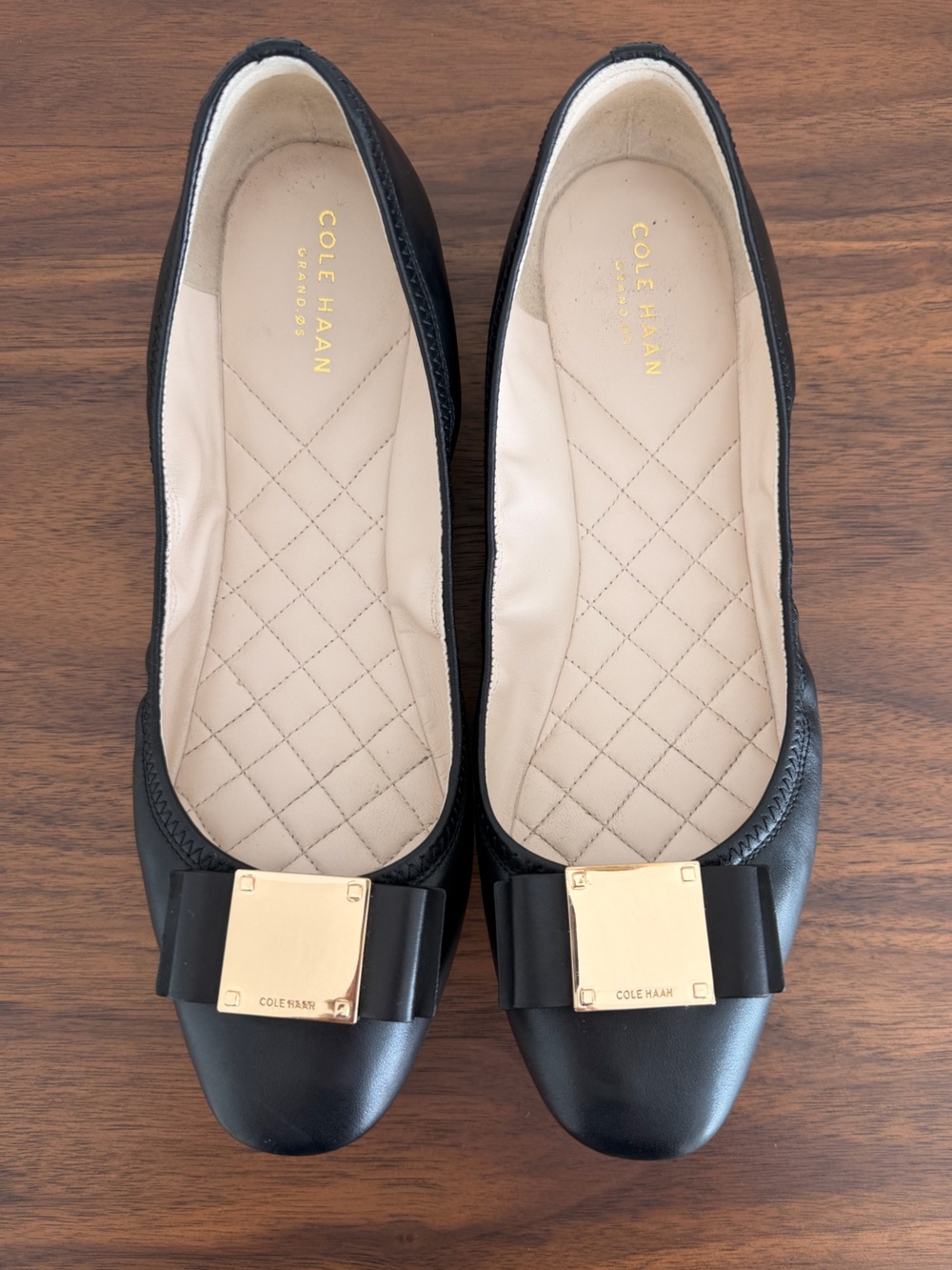 Cole Haan Black Leather Ballet Flats with Gold Buckle Bow Accent